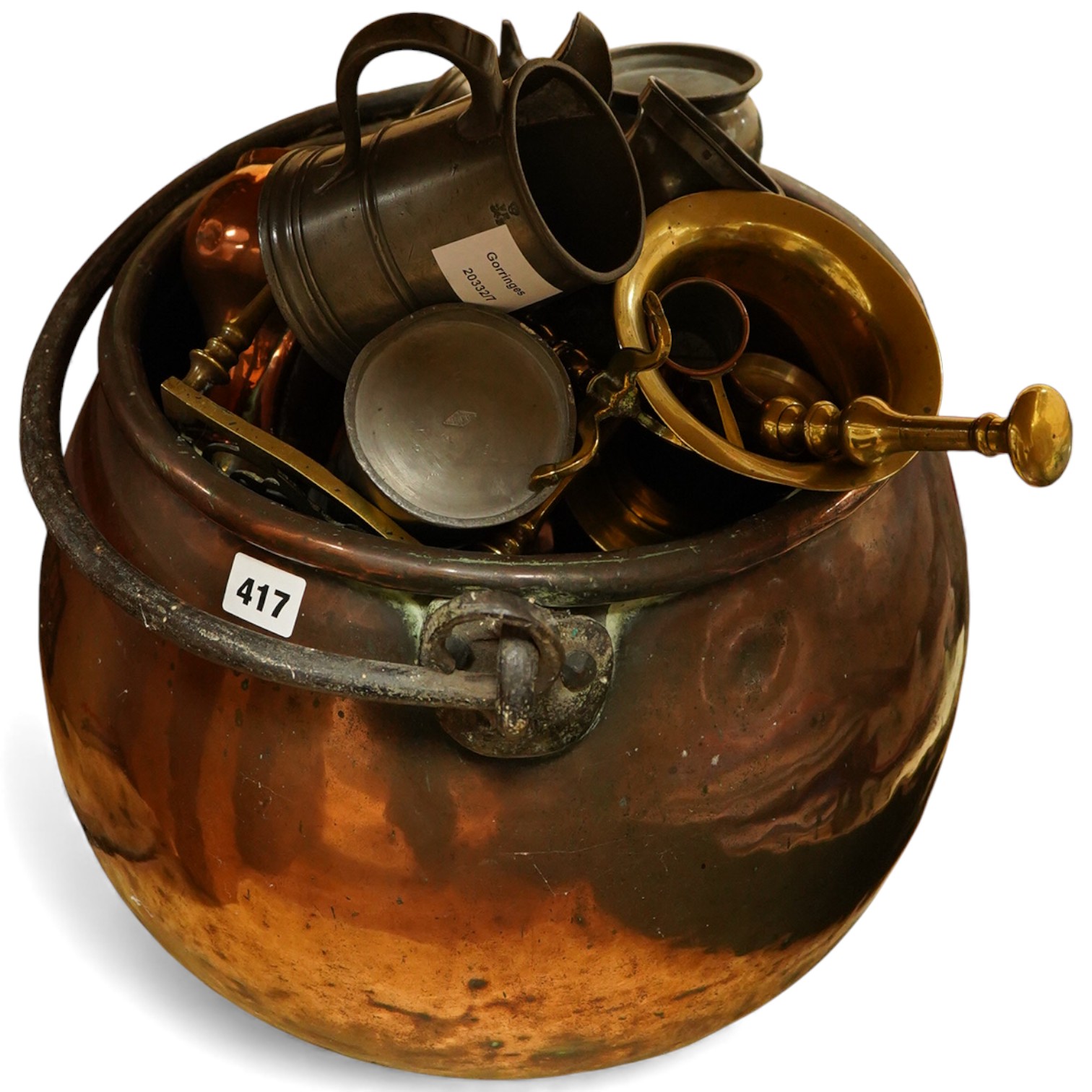 A collection of mixed pewter copper and brass